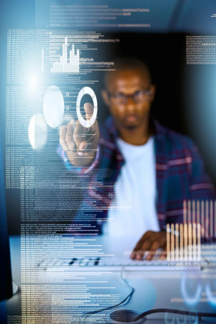 Programmer using a laptop with a holographic dashboard, representing human oversight of agentic AI systems