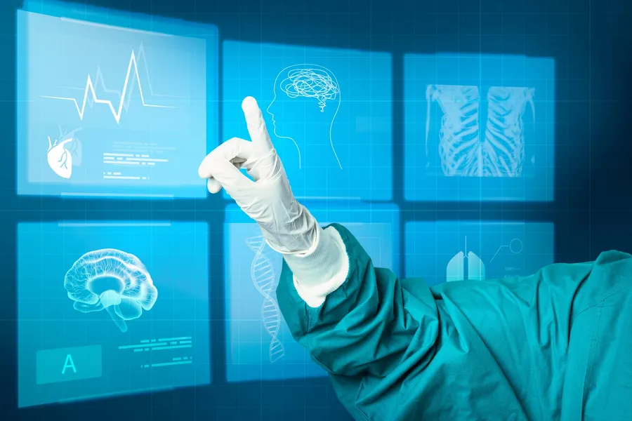 Hand in a medical glove pointing at a virtual screen, representing AI taking the clerical load off clinical records