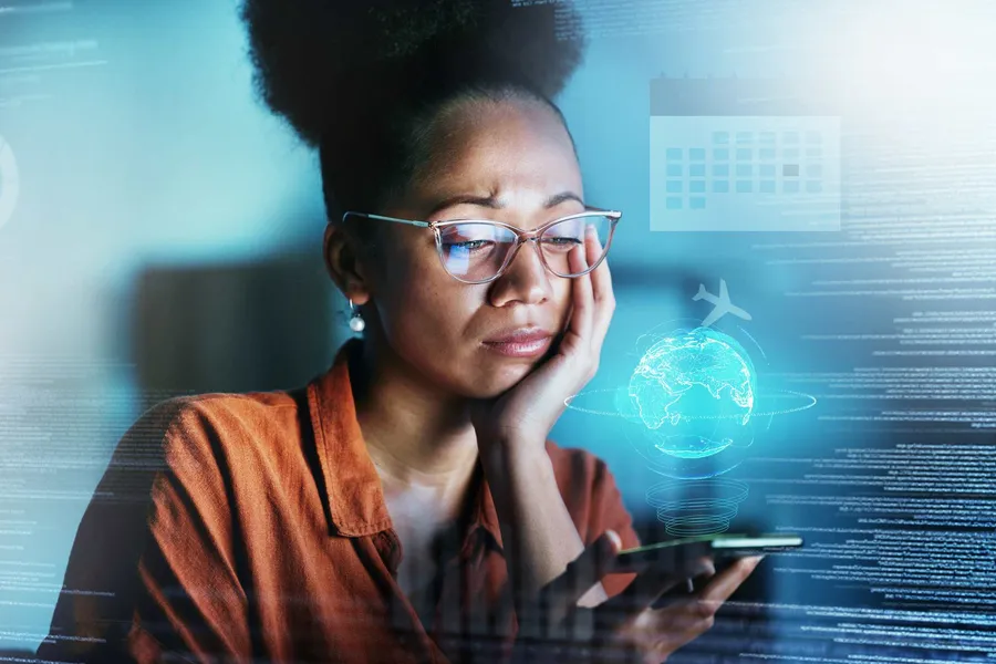 African business professional reviewing digital data and AI research on a phone