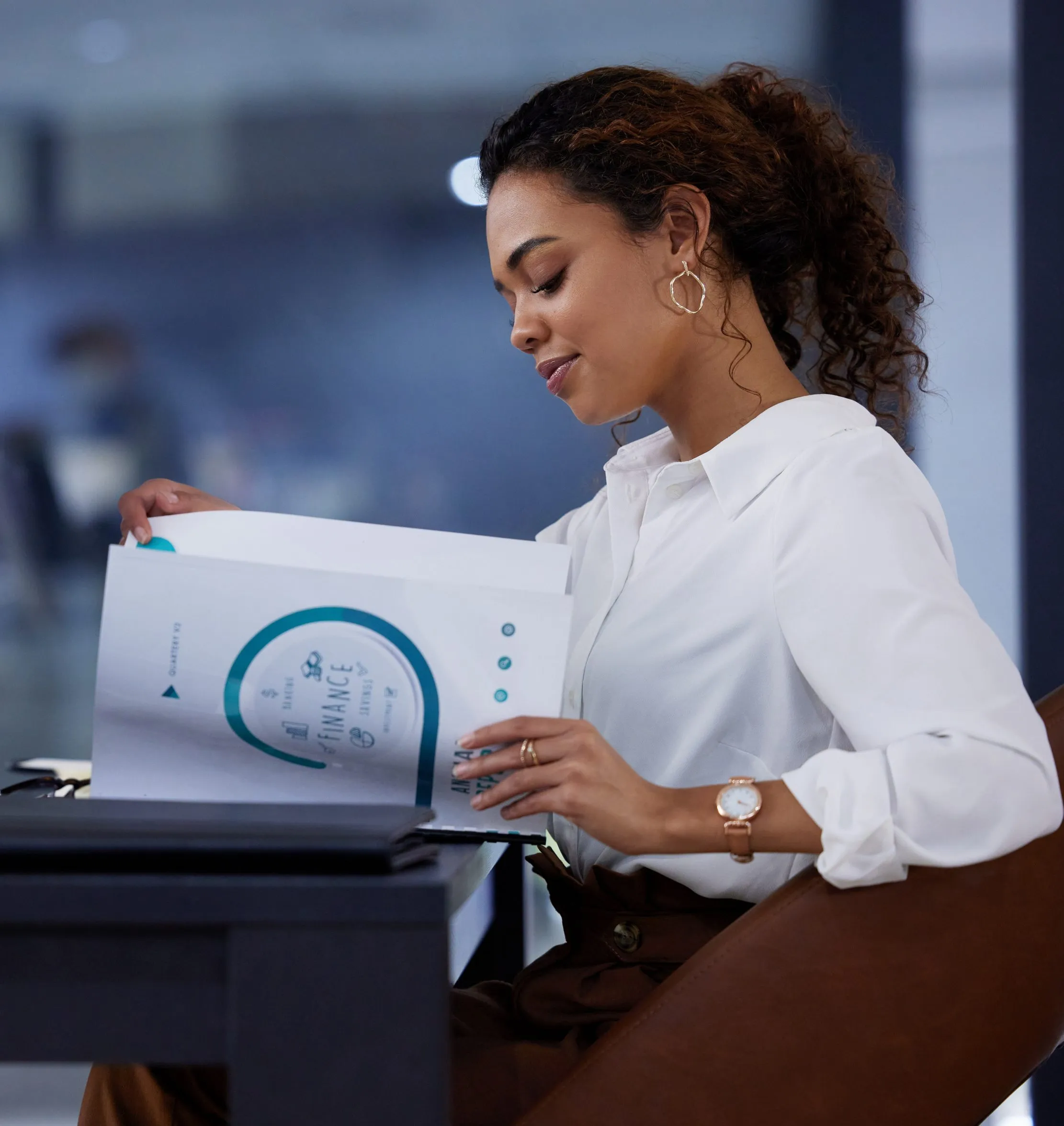 Finance professional reviewing a business document, representing an evidence-led AI-assisted business plan