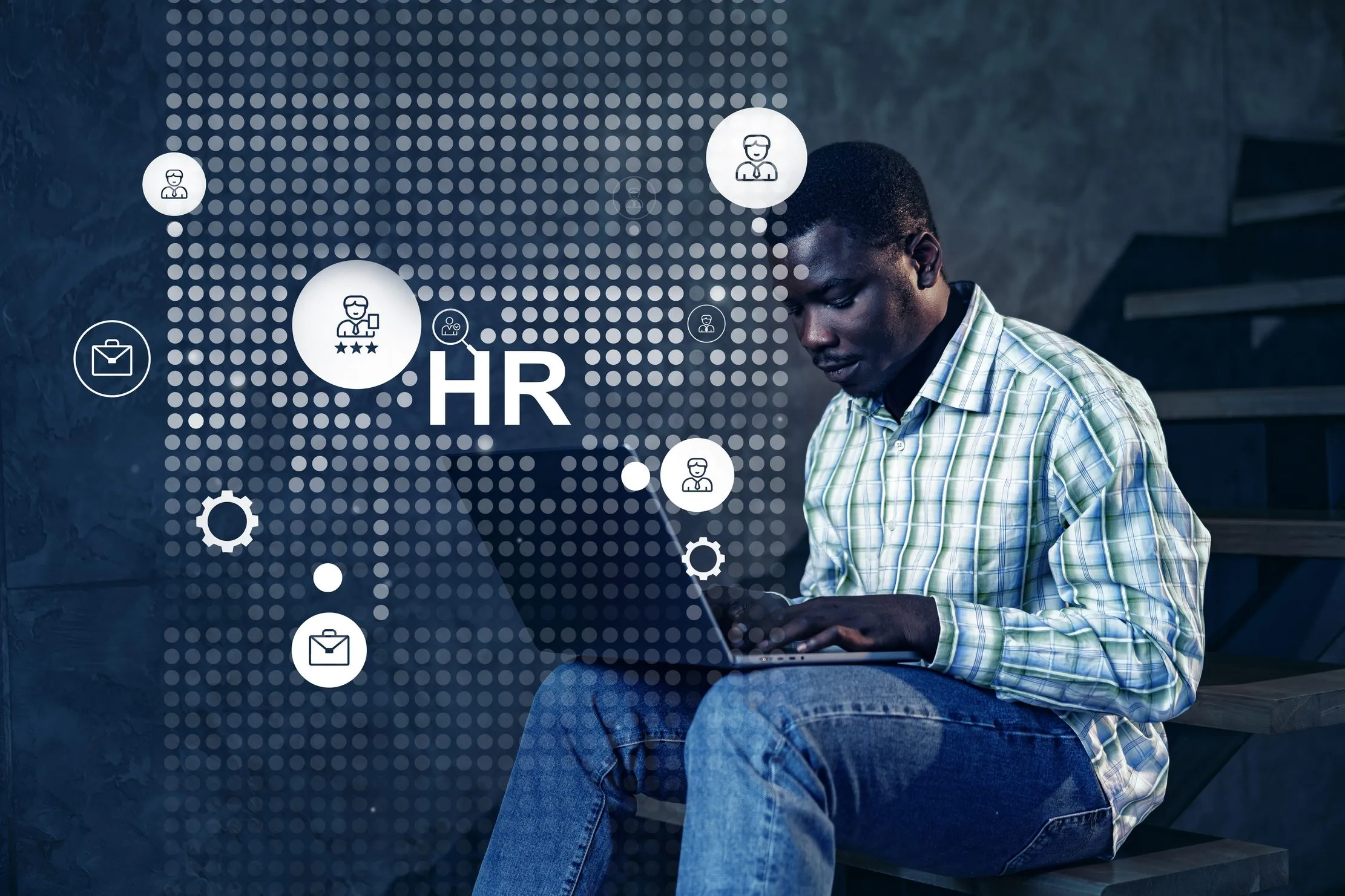 Professional reviewing human resources work on a laptop, representing accountable human oversight in AI-assisted hiring