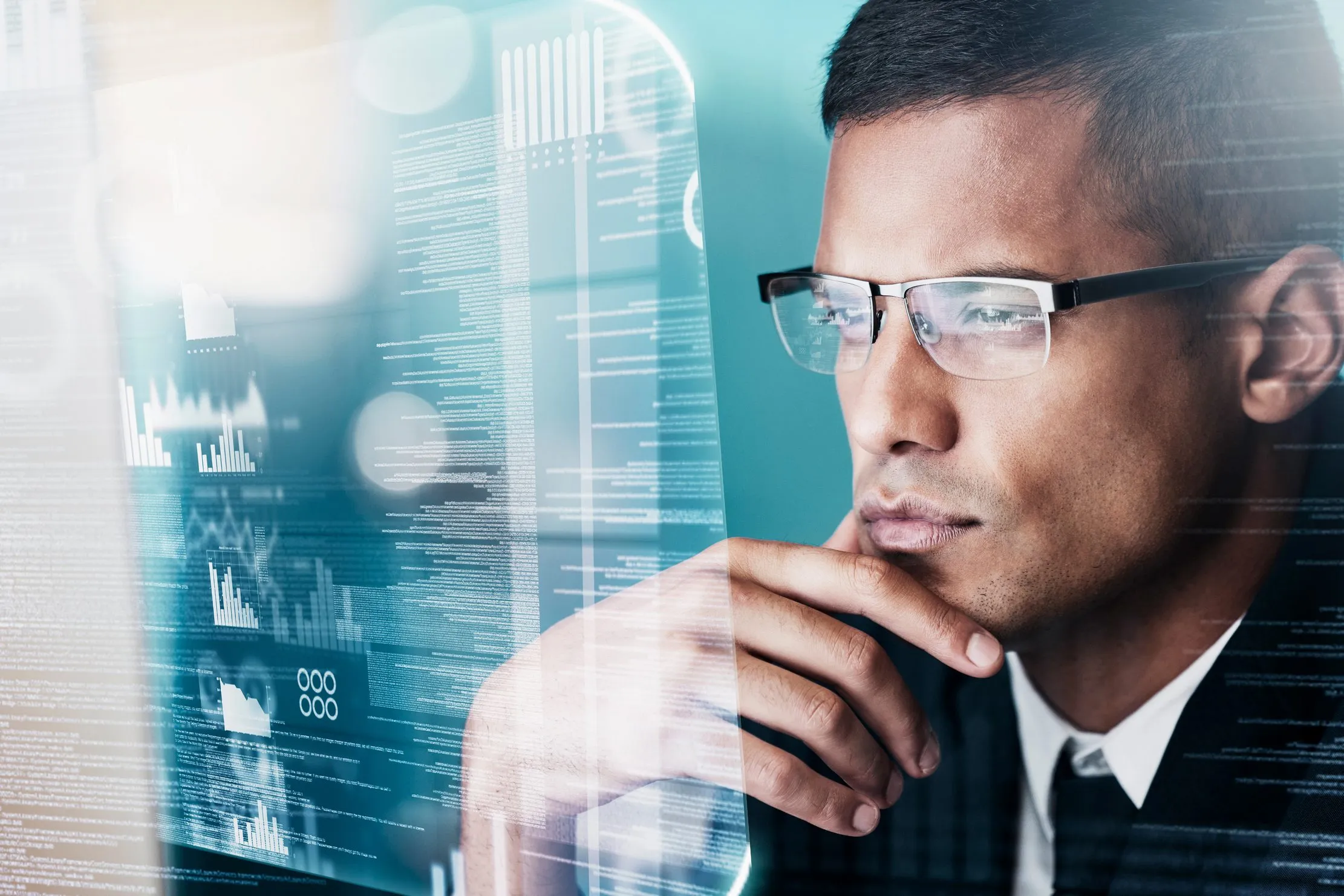 Finance leader studying operational data, representing attribution, sign-off, and accountable AI investment review