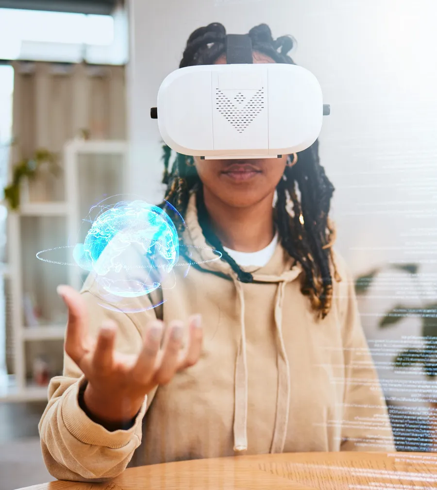 Student using virtual reality with a globe hologram, representing AI learning, diaspora expertise and bilingual digital skills