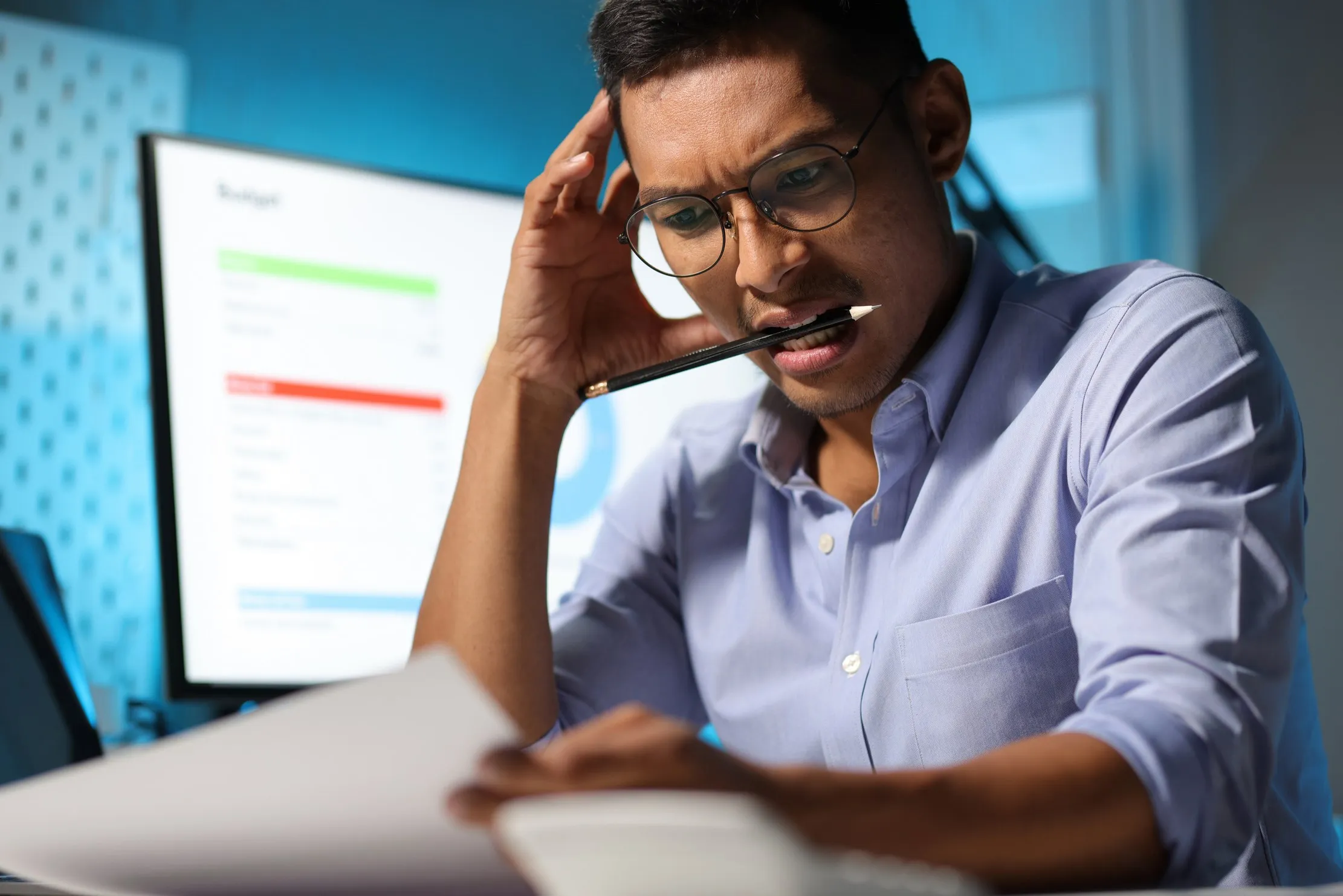 Businessman working late in an office under pressure — testing what happens to a cloud ERP when the internet connection drops