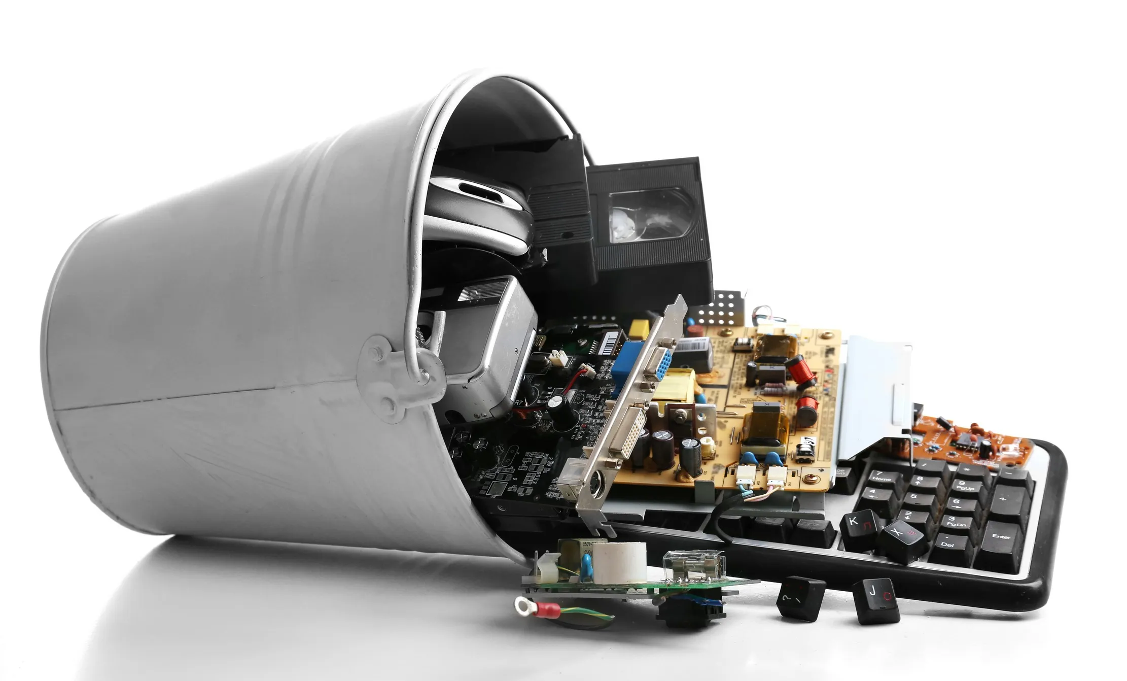 Separated electronic components and boards illustrating the material side of ICT equipment retirement