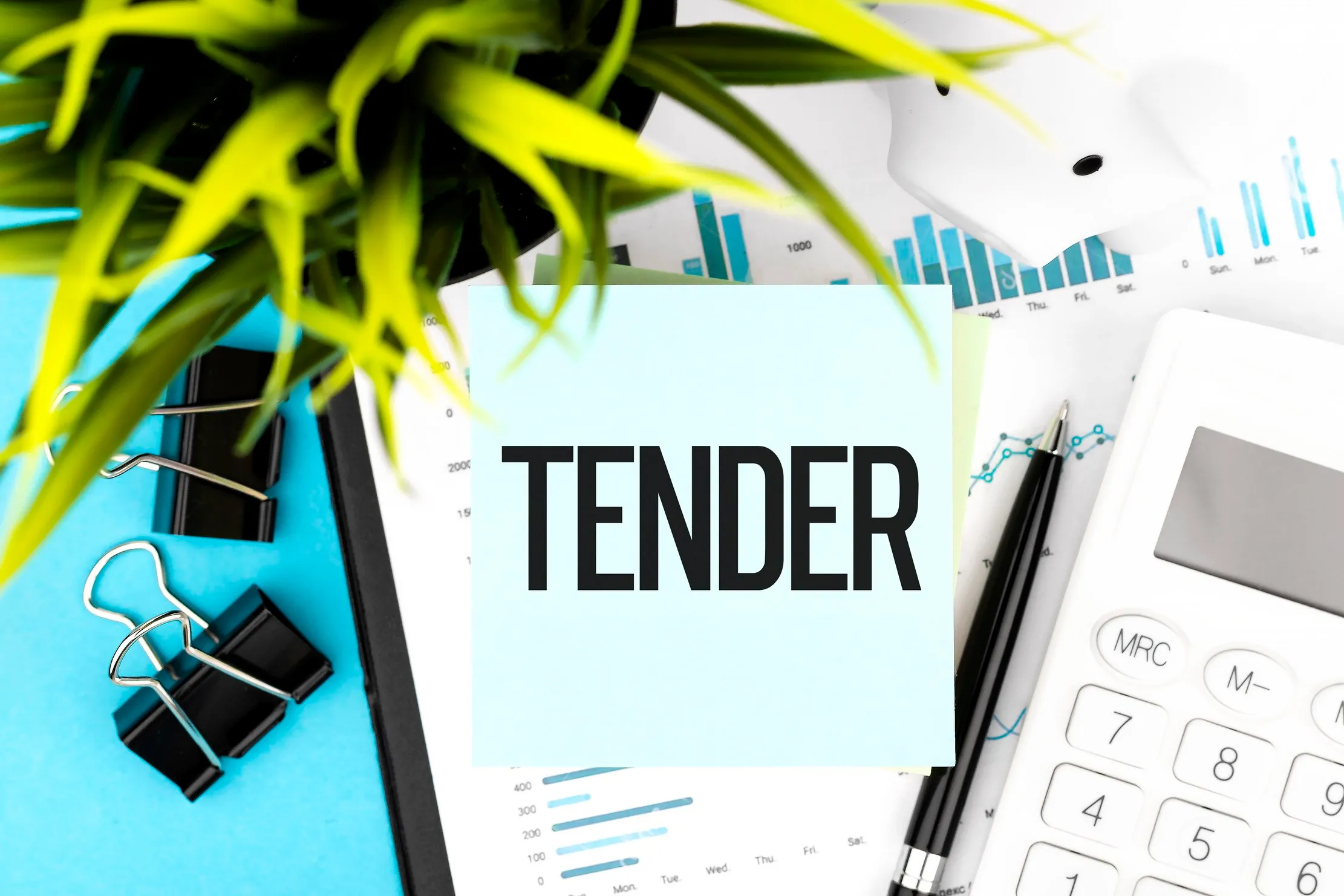 Tender note placed on planning documents and charts