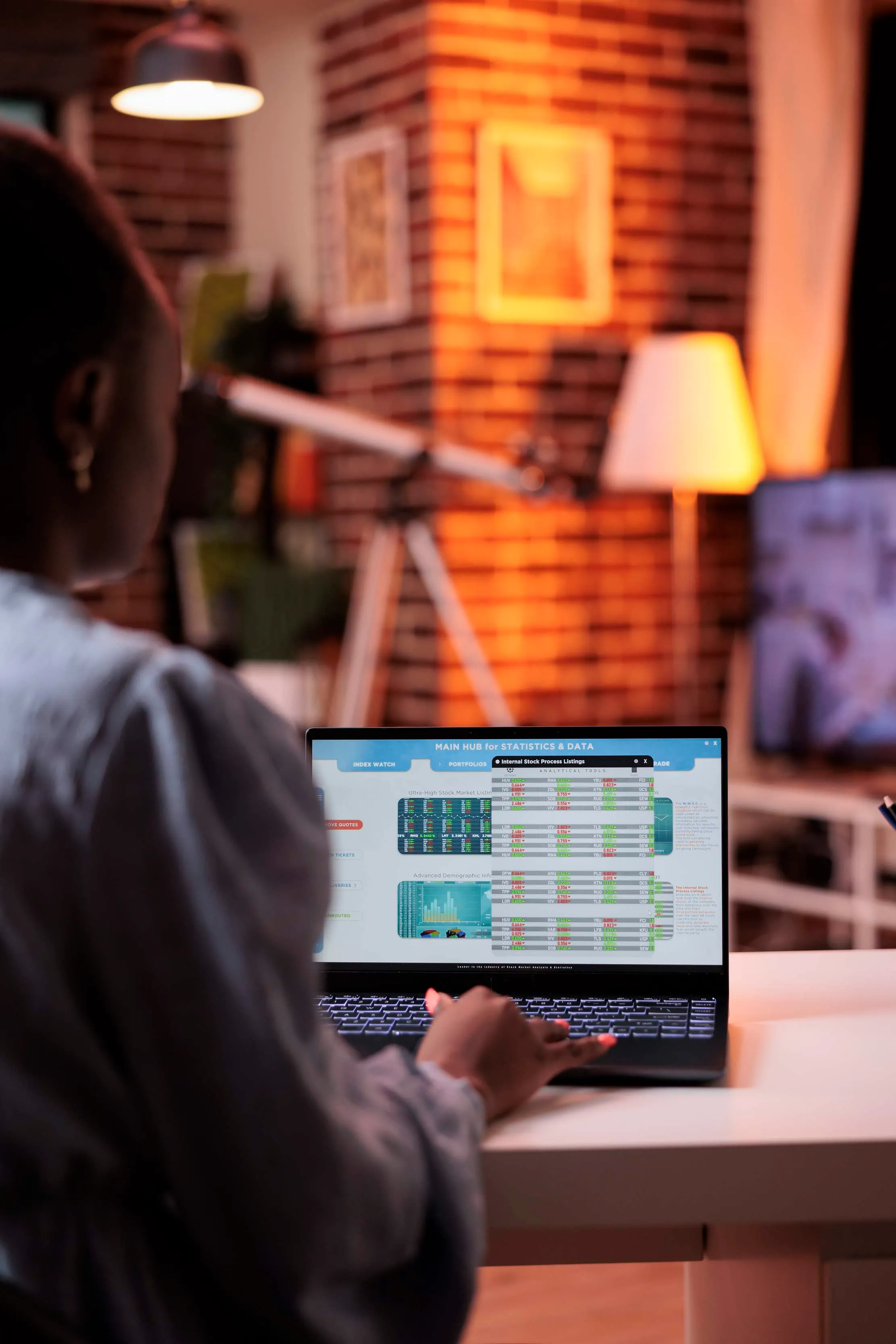 Business owner reviewing financial data on a laptop, representing the control review before moving from spreadsheets