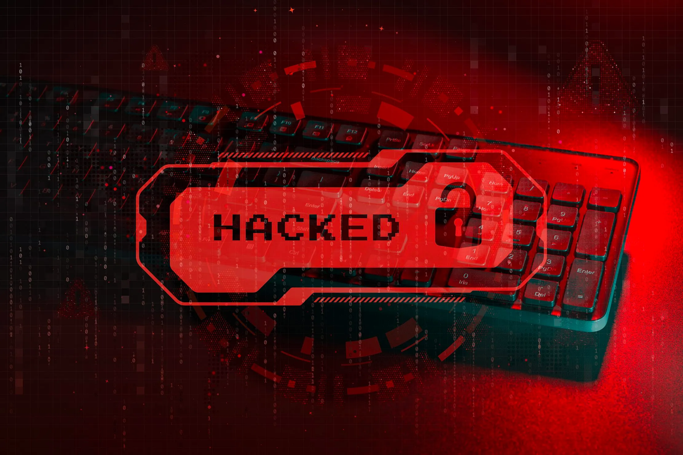 Red hacked warning over a computer keyboard, representing a suspected phishing or malware incident