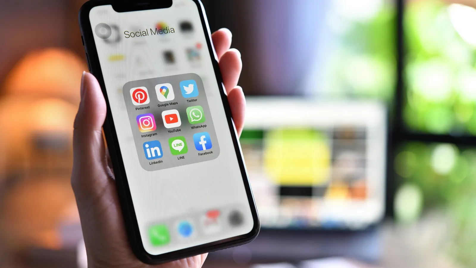 Smartphone showing social media channels for digital marketing planning
