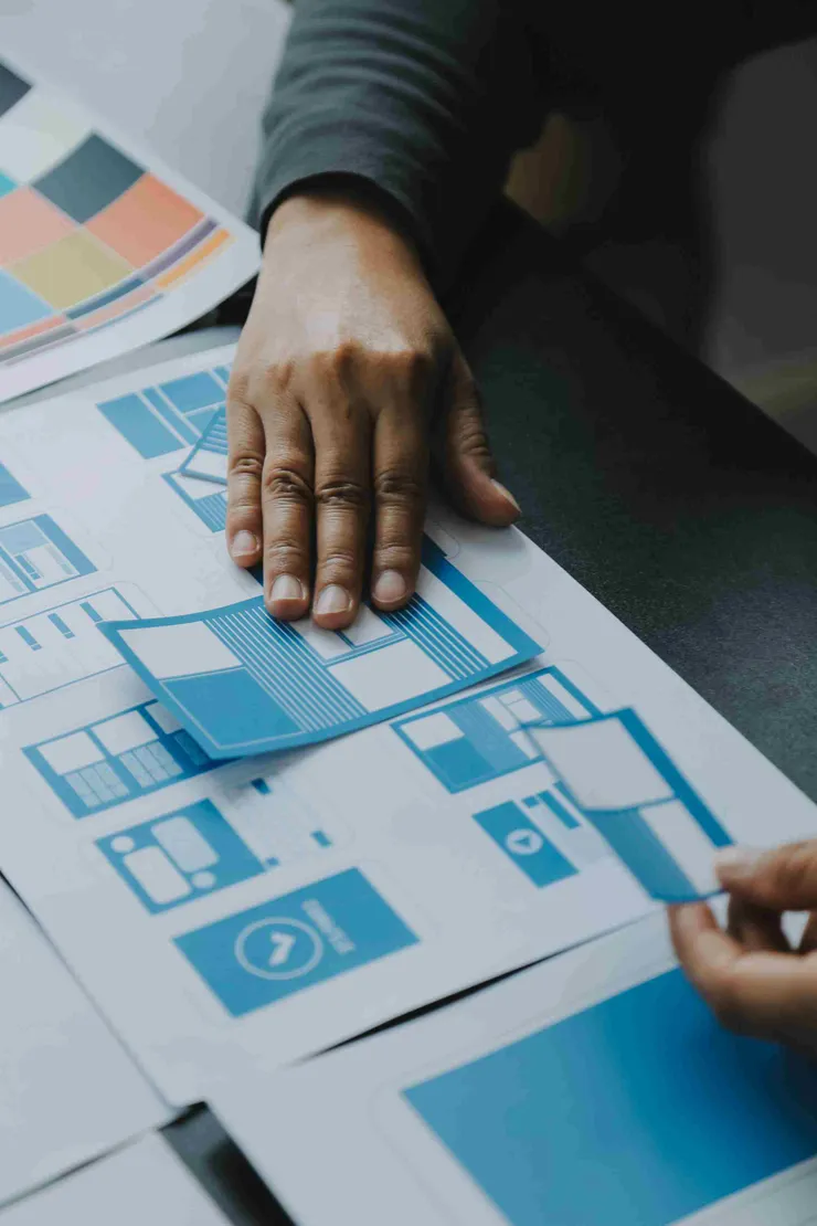 UX developer brainstorming mobile app interface wireframe at desk — user experience design process