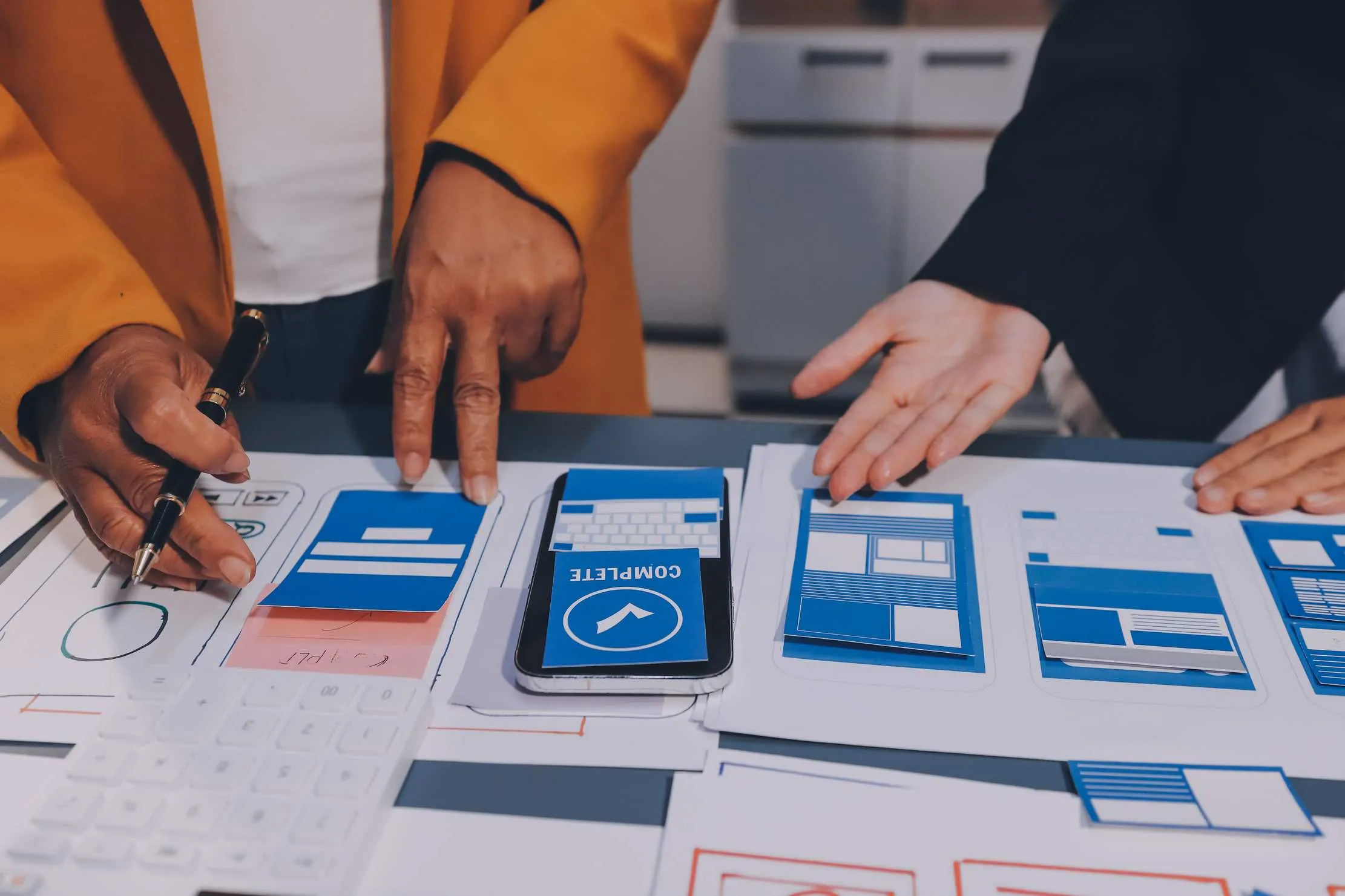 UX and UI design team working on mobile app interface — user experience design for web and mobile applications in East Africa