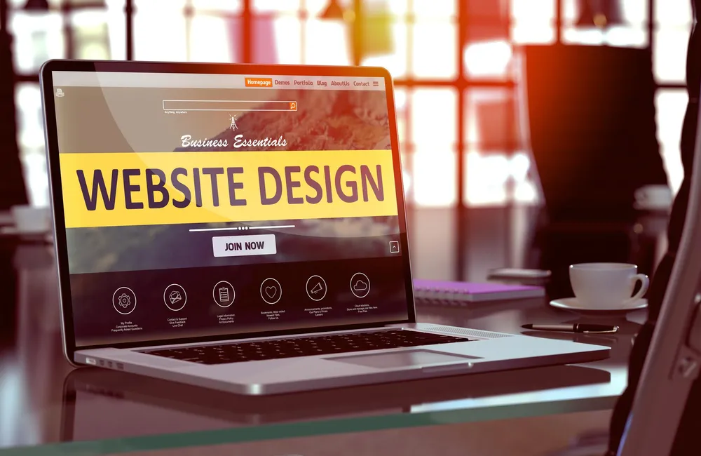 Laptop showing a website design as an example of website delivery work
