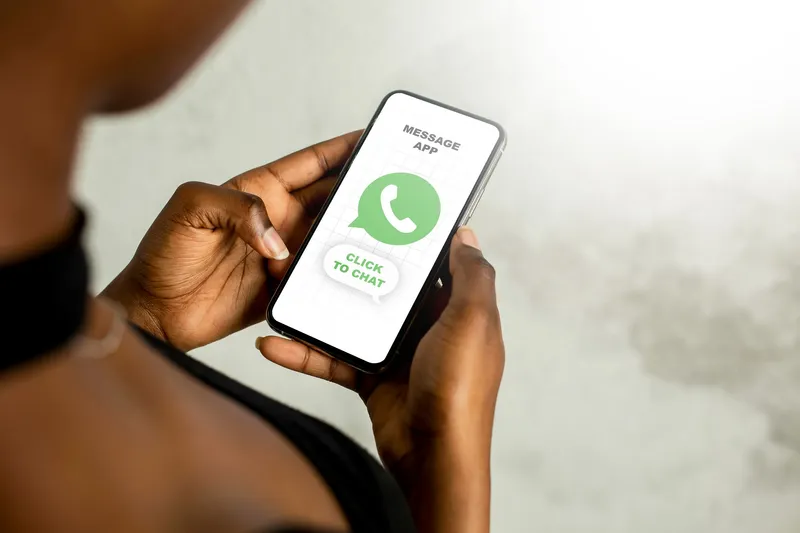 Customer using WhatsApp on a smartphone, representing a helpful WhatsApp AI assistant